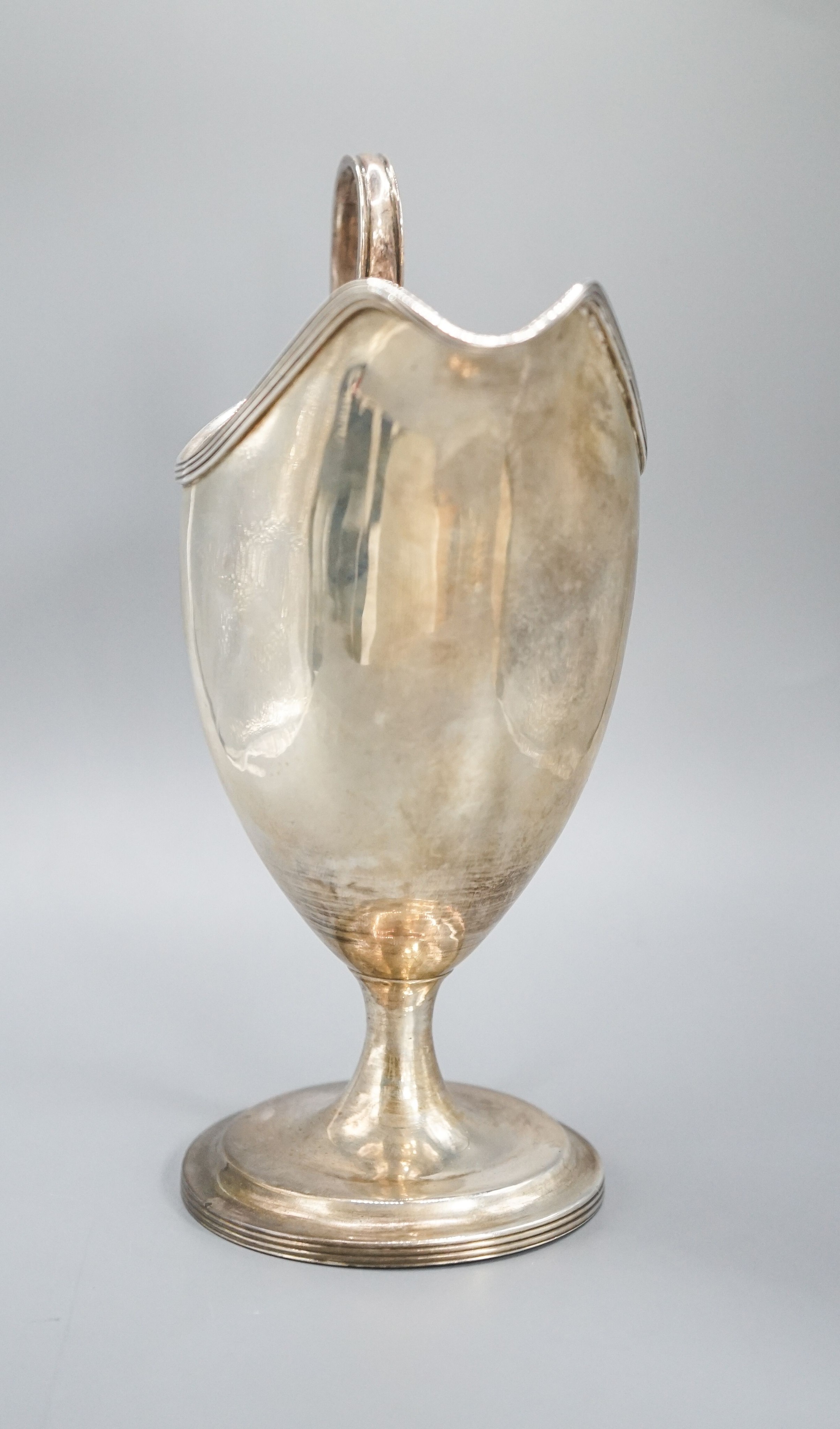 A George III Irish silver pedestal cream jug, George West, Dublin, 1794, 18cm, 7oz.